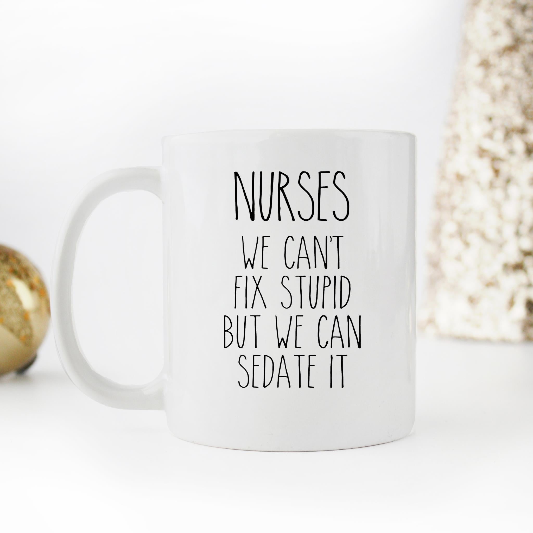 Skitongifts Funny Ceramic Novelty Coffee Mug Nurses We Can't Fix Stupid But We Can Sedate It nlxzHPH