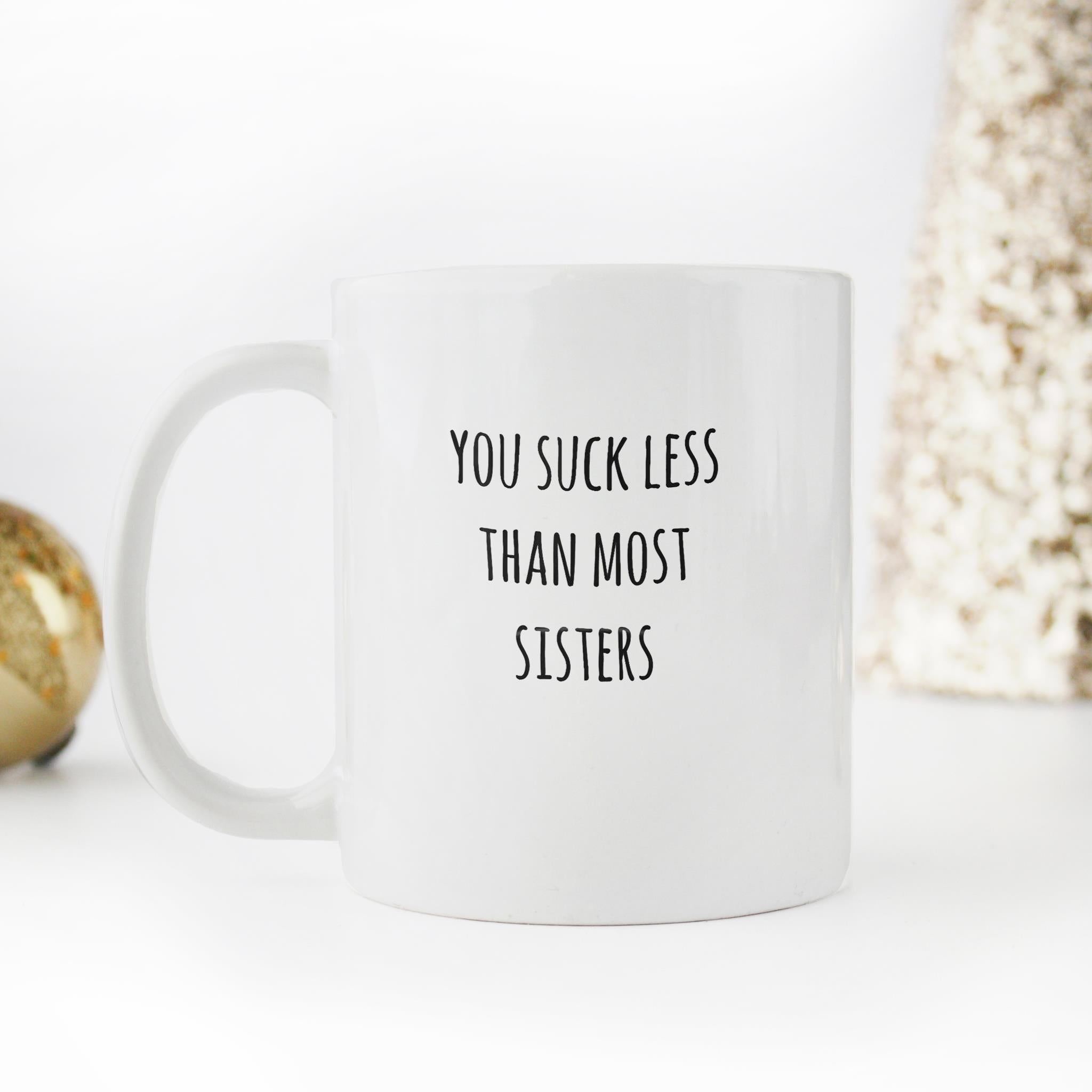 Skitongifts Funny Ceramic Novelty Coffee Mug You Suck Less Than Most Sisters, You Suck Less GnVL93M